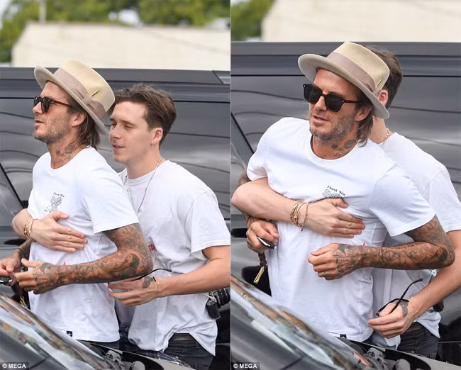 Cũng giống vợ, Beckham cũng vui vẻ hơn rất nhiều so với thái độ ủ dột vài hôm trước khi dẫn vợ con đi chơi. (Ảnh: Mega)