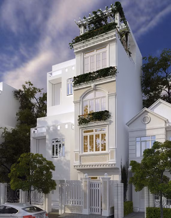 Nhà phố nổi bật với những chi tiết hoa văn tinh xảo, thiết kế nổi trên nền trắng tạo vẻ đẹp sang trọng và quyến rũ. Ảnh: Arhome.
