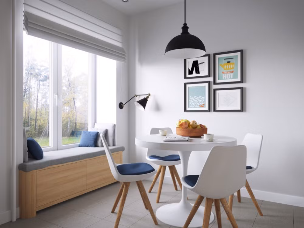 Bàn ăn thiết kế nhỏ gọn và giản dị bố trí cạnh cửa sổ để lấy ánh sáng.