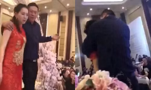 Cô dâu bị bố chồng trêu đùa trong đám cưới.