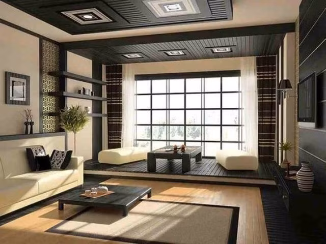 Tác giả đã sử dụng thêm nguyên liệu gỗ để trang trí cho không gian phòng khách. Nội thất thấp, nhỏ, không tốn quá nhiều diện tích giúp căn phòng rộng rãi và thoáng đãng bội phần.