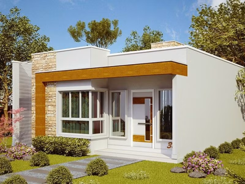 Nhà mái bằng hiện đại sở hữu kiến trúc ngoại thất trẻ trung với sự kết hợp màu sắc ở mặt tiền hài hòa, tạo hình có điểm nhấn kết hợp chất liệu kính, gỗ công nghiệp. Ảnh: Angcovat.