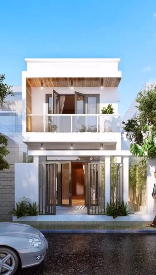  Mẫu nhà ống 2 tầng 400 triệu kiến trúc hiện đại, sử dụng lan can kính ở ban công tầng 2. Ảnh: Kientrucsuvietnam.