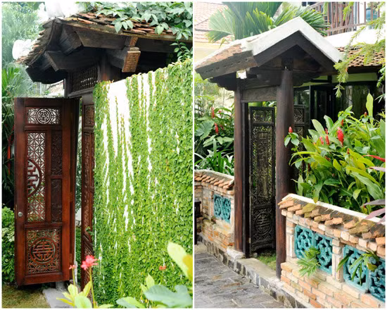 Bao quanh bởi cây xanh, hoa lá, lối vào nhà Hồng Nhung gây ấn tượng mạnh với cánh cổng gỗ chạm trổ kỳ công và mái ngói xô nghiêng. Ảnh: Vietnamnet.