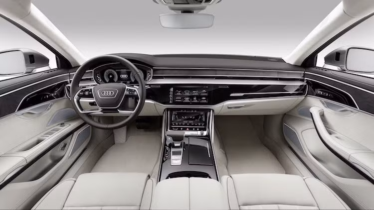 Ở bên trong nội thất, một lần nữa A8 lại chịu ảnh hưởng từ Prologue Concept với bảng táp-lô tối giản, góc cạnh và vô-lăng thiết kế tương tự. Dù không có màn hình lớn trước mặt ghế phụ nhưng cũng giống như Prologue Concept, Audi đã "số hóa" toàn bộ cụm điều khiển của xe với bảng điều khiển trung tâm là những màn hình cảm ứng, cùng với bảng đồng hồ Virtual Cockpit quen thuộc của hãng.