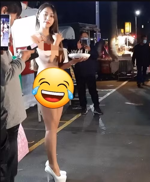 Hình ảnh cô gái đến từ Đài Loan ăn mặc hở hang cụ thể là bikini đứng bán ổi dưới thời tiết 9 độ C từng được netizen truyền tay nhau.