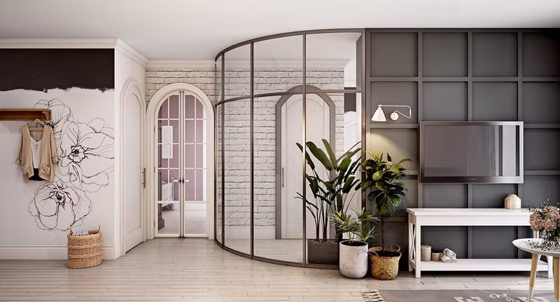 Cây xanh tạo bước đệm linh hoạt dễ dàng chuyển đổi từ tường bê tông sang tường kính. Vách kính thiết kế cong, tăng sự mềm mại và uyển chuyển trong cấu trúc nhà ở.