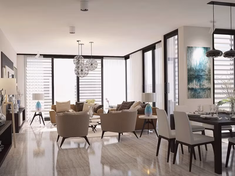 Phòng khách đặt liền kề bàn ăn và cùng sử dụng nguồn ánh sáng tự nhiên từ cửa sổ.