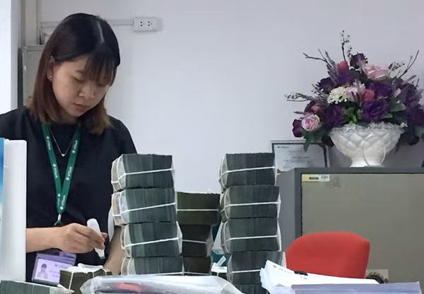 Thưởng Tết năm 2018 được nhận định ở mức khả quan hơn so với năm 2017 - Ảnh: Tạ Tôn Hồng Liên