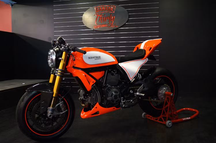 Tham gia vào cuộc thi Custom Rumble với tư cách là đại diện duy nhất tới từ Australia, Canberra Motorcycle Center đã dự đoán rằng sẽ có rất nhiều bản độ Ducati Scrambler theo các phong cách phổ biến như cafe racer, tracker hay scrambler. 