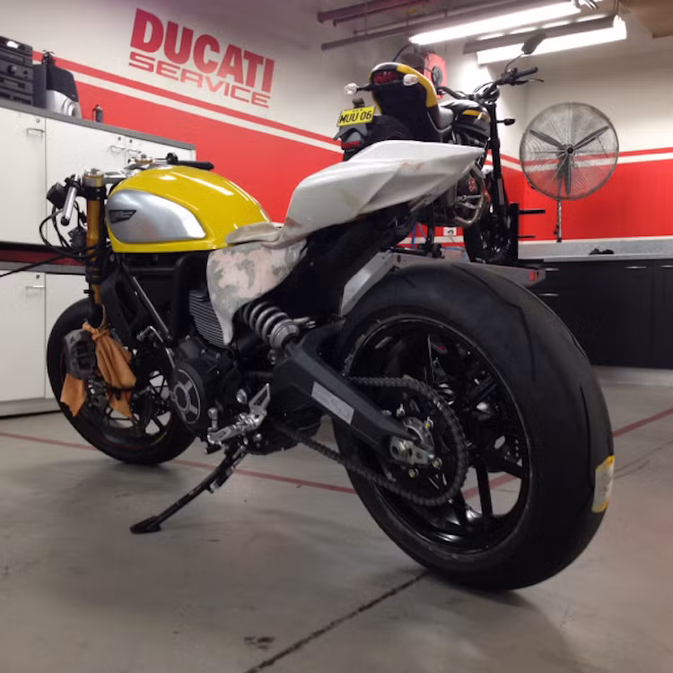 Bản độ của Canberra Motorcycle Center nhanh chóng được đặt tên là Scramblegale - ghép từ "Scrambler" và "Panigale". Phần đuôi của Panigale đã được họ "chế" lại để lắp lên Scrambler, cùng với các tấm ốp thân xe "hàng thửa" từ nhựa tổng hợp.