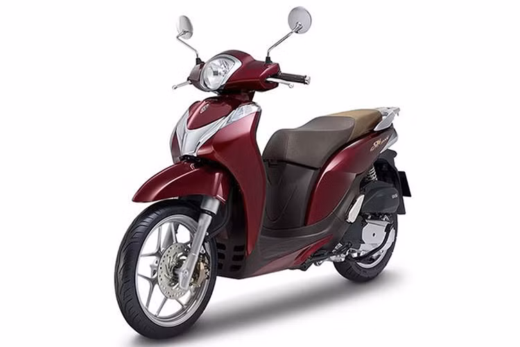 Với định hướng nhắm tới đối tượng khách hàng là nữ giới, mới đây mẫu xe ga Honda SH Mode 125 đã được Honda Việt Nam bổ sung màu sắc mới cho phiên bản trang bị phanh CBS. Khác với 2 màu trắng ngà và xanh lam được bổ sung trong phiên bản ra mắt hồi tháng 12/2018, màu đỏ nâu đậm mới này sẽ giúp xe có phần “sang” hơn.