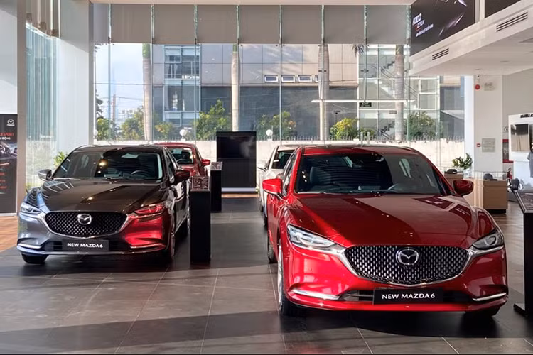 Mazda Viet Nam dieu chinh gia ban oto... 