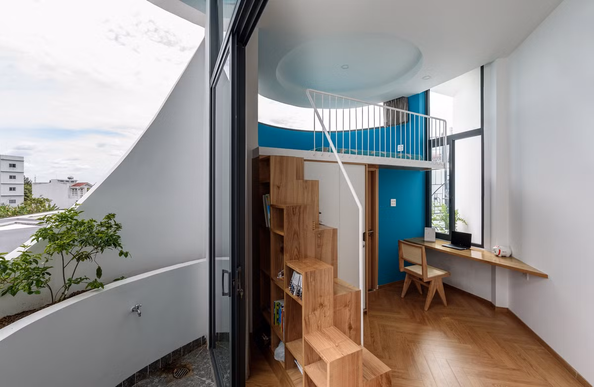 Phòng ngủ tích hợp góc học tập. Ảnh: Lonton Studio